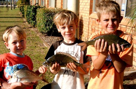 James, Luke and Dylan show off their fish